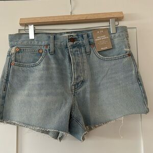 Madewell Midrise denim shorts.  They are a relaxed fit in a light wash.